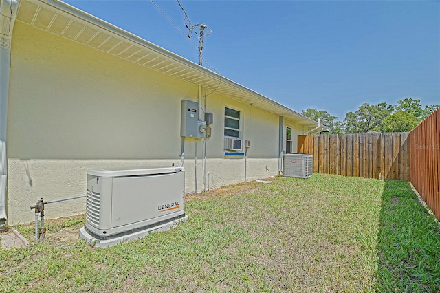 view of yard with central AC and cooling unit