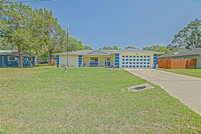 view of front facade with concrete driveway, an attached garage, and stucco siding
