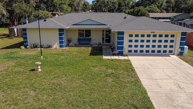 view of front of property with a garage, concrete driveway, covered porch, a front yard, and stucco siding