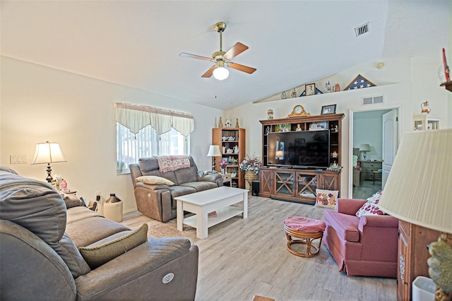 living room with ceiling fan, wood finished floors, and vaulted ceiling