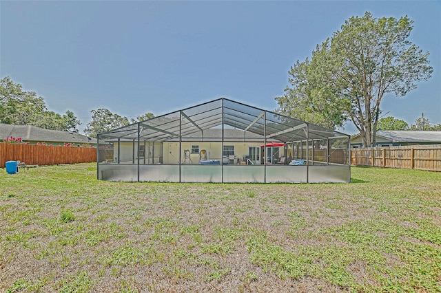 back of house featuring a lanai