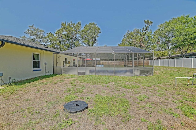 view of yard with a lanai