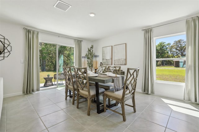 4955 SW 51st Rd, Gainesville, FL 32608 - dining area featuring light tile patterned flooring and baseboards