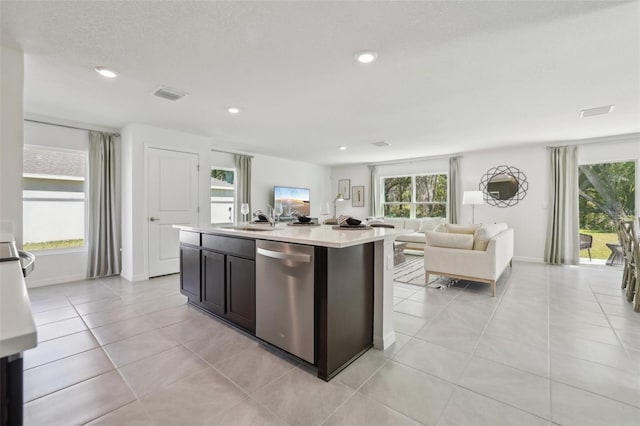 4955 SW 51st Rd, Gainesville, FL 32608 - kitchen featuring dishwasher, light countertops, open floor plan, recessed lighting, and a sink