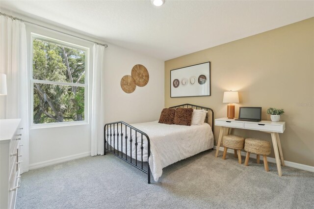 4955 SW 51st Rd, Gainesville, FL 32608 - carpeted bedroom with baseboards
