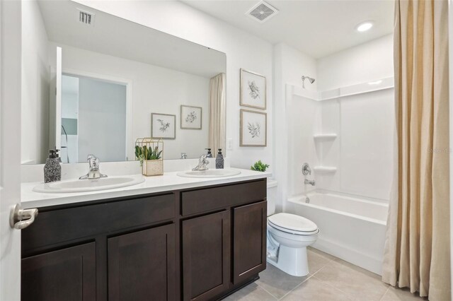 4955 SW 51st Rd, Gainesville, FL 32608 - full bath with toilet, tile patterned floors, shower / bath combo, and double vanity
