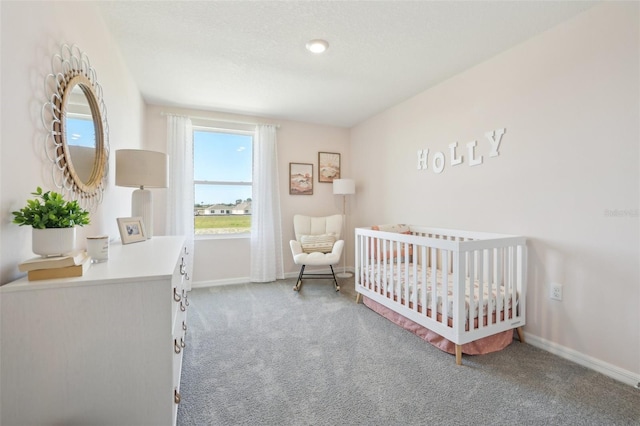 4955 SW 51st Rd, Gainesville, FL 32608 - carpeted bedroom with a crib and baseboards