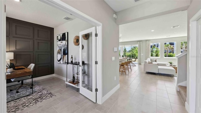 office area with baseboards, light tile patterned flooring, and recessed lighting