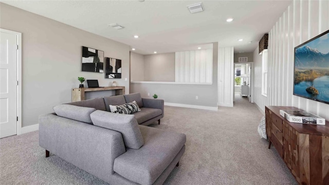 carpeted living room with baseboards and recessed lighting