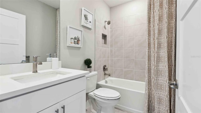 full bathroom featuring toilet, vanity, and shower / bathtub combination with curtain