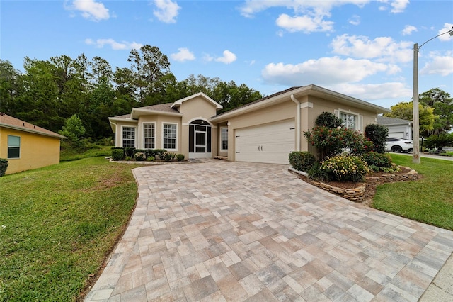2631 SW 20th Cir, Ocala, FL 34471 - ranch-style house featuring decorative driveway, a front yard, an attached garage, and stucco siding