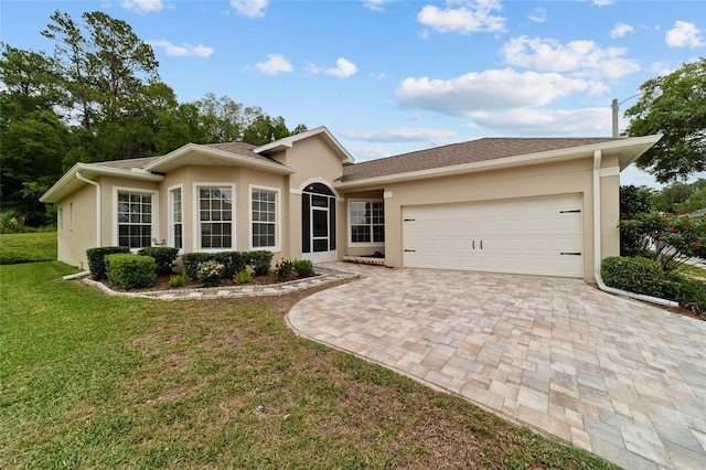 2631 SW 20th Cir, Ocala, FL 34471 - ranch-style home with driveway, an attached garage, a front lawn, and stucco siding