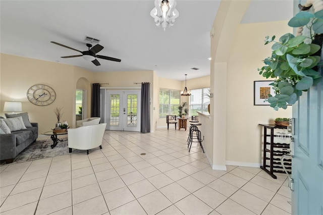 2631 SW 20th Cir, Ocala, FL 34471 - living area featuring a chandelier, light tile patterned floors, baseboards, and a ceiling fan