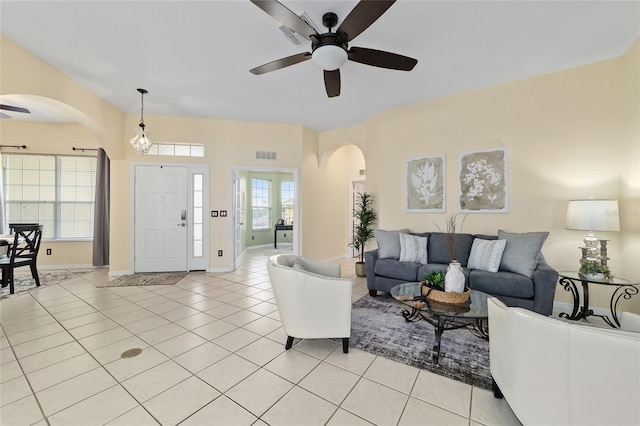 2631 SW 20th Cir, Ocala, FL 34471 - living room featuring ceiling fan, arched walkways, and light tile patterned floors