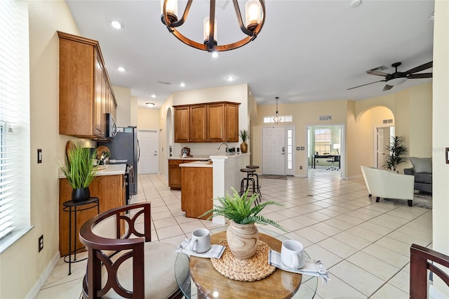 2631 SW 20th Cir, Ocala, FL 34471 - living area with arched walkways, a chandelier, light tile patterned floors, recessed lighting, and baseboards