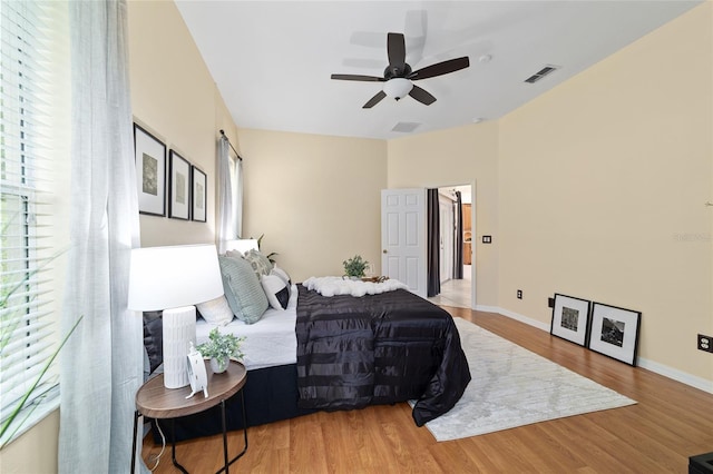 2631 SW 20th Cir, Ocala, FL 34471 - bedroom with wood finished floors, baseboards, and ceiling fan