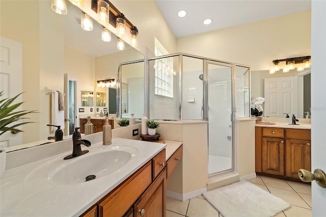 2631 SW 20th Cir, Ocala, FL 34471 - bathroom featuring tile patterned floors, two vanities, and a stall shower