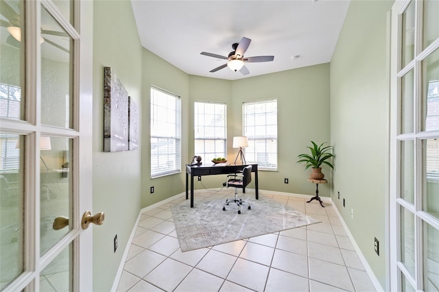 2631 SW 20th Cir, Ocala, FL 34471 - office area featuring french doors, light tile patterned flooring, a ceiling fan, and baseboards