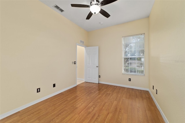 2631 SW 20th Cir, Ocala, FL 34471 - spare room with light wood finished floors, a ceiling fan, and baseboards