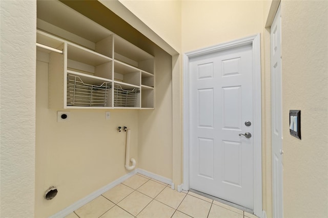 2631 SW 20th Cir, Ocala, FL 34471 - washroom with hookup for an electric dryer, light tile patterned floors, and baseboards