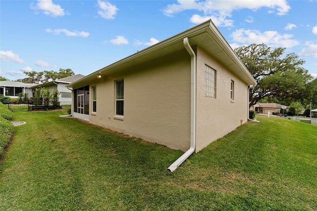 2631 SW 20th Cir, Ocala, FL 34471 - view of side of property with stucco siding and a lawn