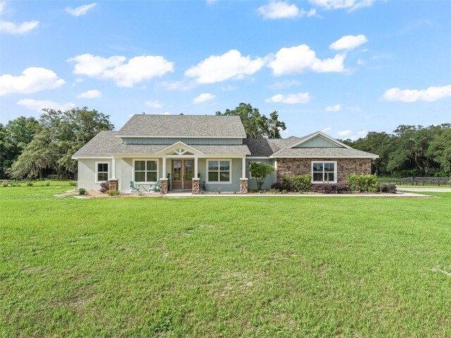 5330 NE 111th Lane Rd, Anthony, FL 32617 - craftsman-style home featuring a front yard and a shingled roof
