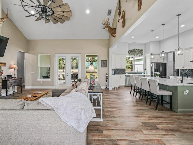 5330 NE 111th Lane Rd, Anthony, FL 32617 - living room featuring high vaulted ceiling, ceiling fan, wood finished floors, recessed lighting, and baseboards