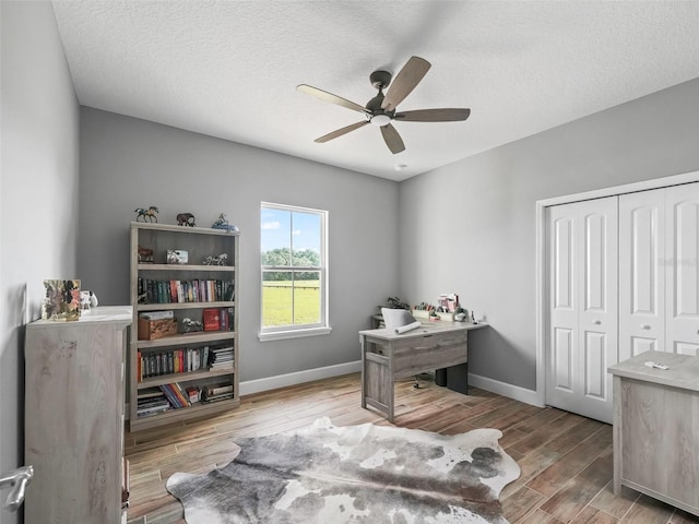 5330 NE 111th Lane Rd, Anthony, FL 32617 - office space featuring wood finished floors, ceiling fan, baseboards, and a textured ceiling