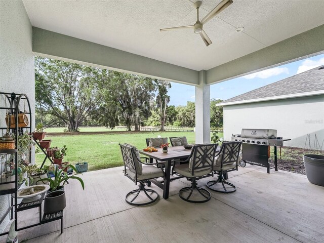 5330 NE 111th Lane Rd, Anthony, FL 32617 - view of patio / terrace with grilling area, a ceiling fan, and outdoor dining space