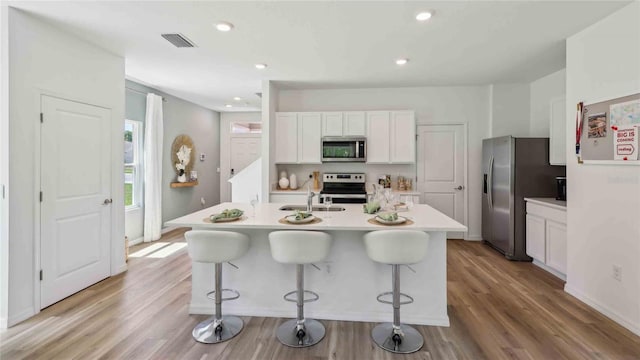 8647 SW 44th Ter, Ocala, FL 34476 - kitchen with appliances with stainless steel finishes, light countertops, white cabinetry, a sink, and recessed lighting