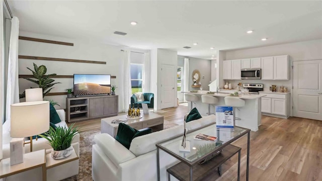 8647 SW 44th Ter, Ocala, FL 34476 - living room with recessed lighting and light wood-style flooring