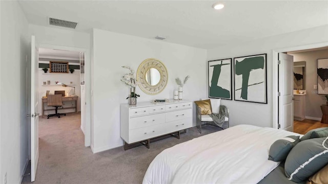 8647 SW 44th Ter, Ocala, FL 34476 - bedroom featuring carpet, an office area, ensuite bath, and baseboards