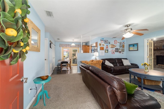 6060 SE 119th Pl, Belleview, FL 34420 - living area featuring french doors, light carpet, ceiling fan, and baseboards
