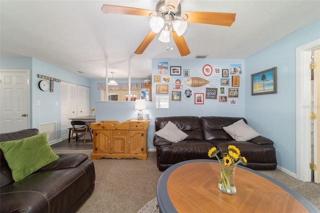 6060 SE 119th Pl, Belleview, FL 34420 - carpeted living area with baseboards and a ceiling fan