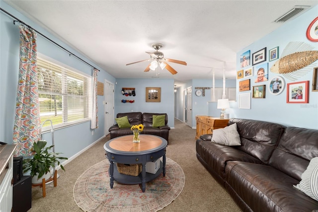 6060 SE 119th Pl, Belleview, FL 34420 - living room featuring carpet floors, a ceiling fan, and baseboards