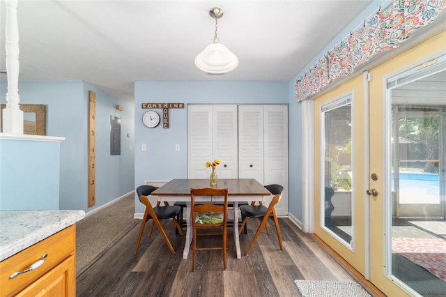 6060 SE 119th Pl, Belleview, FL 34420 - dining area with electric panel, dark wood-type flooring, and baseboards