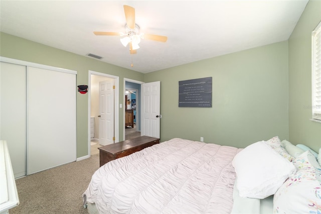 6060 SE 119th Pl, Belleview, FL 34420 - carpeted bedroom with ceiling fan and a closet
