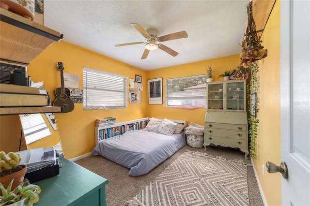 6060 SE 119th Pl, Belleview, FL 34420 - bedroom featuring carpet floors, ceiling fan, and baseboards