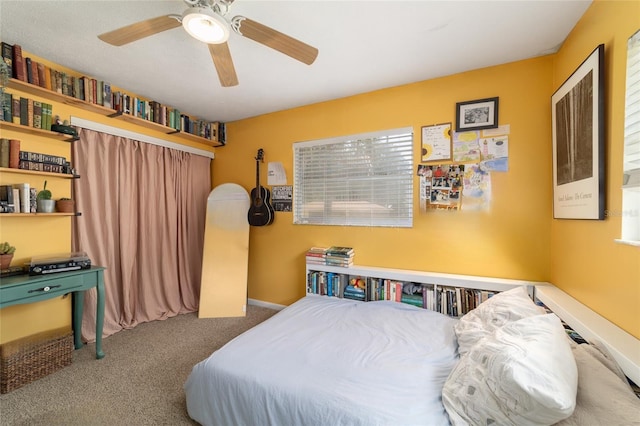 6060 SE 119th Pl, Belleview, FL 34420 - bedroom featuring carpet floors, ceiling fan, and baseboards