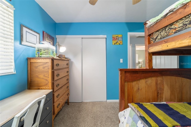 6060 SE 119th Pl, Belleview, FL 34420 - carpeted bedroom with a closet and a ceiling fan