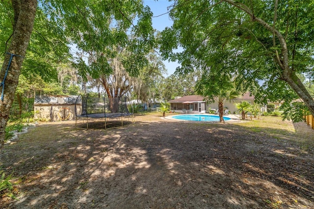 6060 SE 119th Pl, Belleview, FL 34420 - view of yard featuring a trampoline