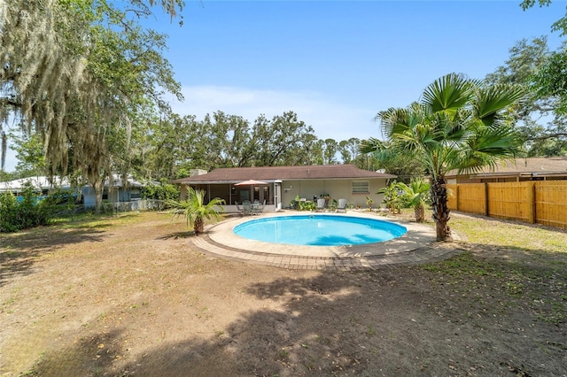 6060 SE 119th Pl, Belleview, FL 34420 - view of pool featuring a fenced backyard and a patio