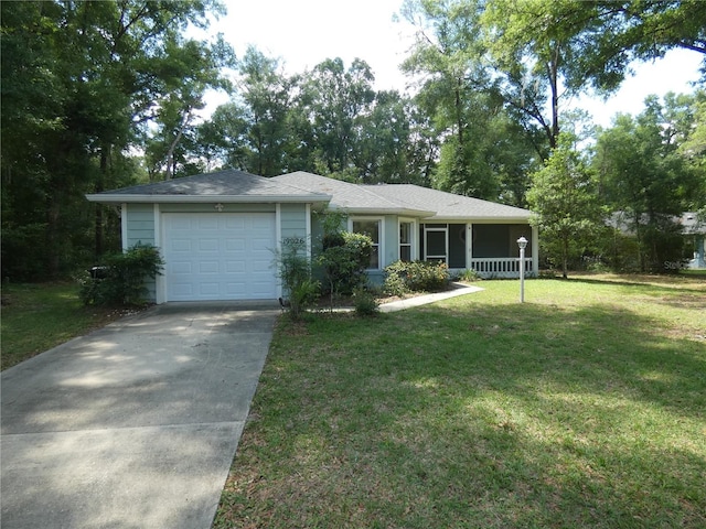 19026 SW 100th Pl, Dunnellon, FL 34432 - ranch-style home with a garage, driveway, and a front yard