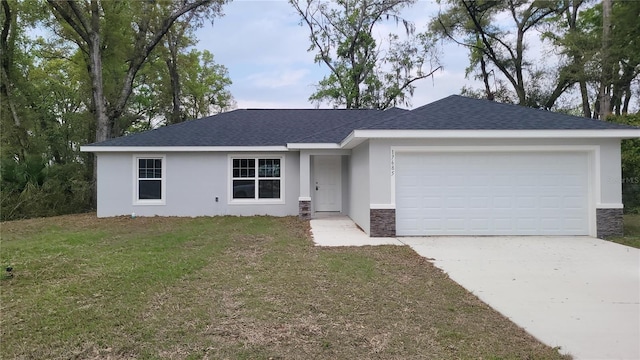 17685 SW 112th Ln, Dunnellon, FL 34432 - ranch-style home with driveway, stucco siding, an attached garage, and stone siding