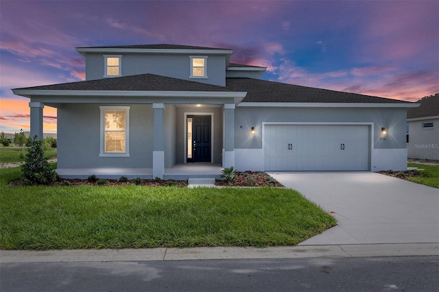 7536 SW 60th St, Ocala, FL 34476 - view of front of house featuring an attached garage, stucco siding, covered porch, and driveway
