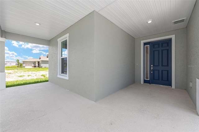 7536 SW 60th St, Ocala, FL 34476 - view of exterior entry featuring stucco siding