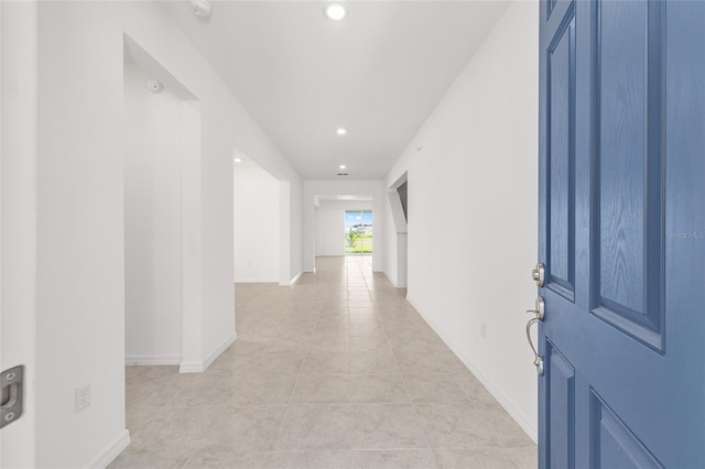 7536 SW 60th St, Ocala, FL 34476 - hallway featuring recessed lighting, light tile patterned floors, and baseboards