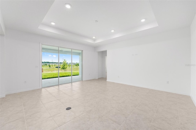7536 SW 60th St, Ocala, FL 34476 - unfurnished room featuring a tray ceiling, recessed lighting, baseboards, and light tile patterned floors