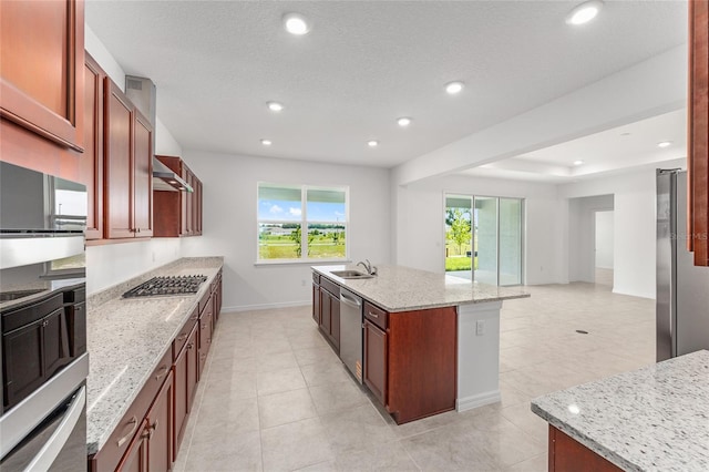 7536 SW 60th St, Ocala, FL 34476 - kitchen with appliances with stainless steel finishes, baseboards, a sink, recessed lighting, and a kitchen island with sink