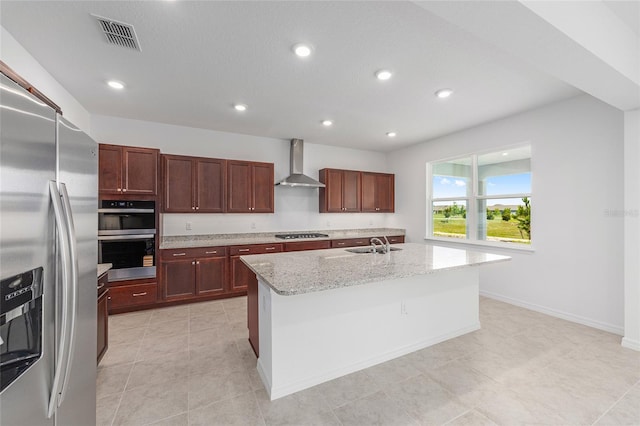 7536 SW 60th St, Ocala, FL 34476 - kitchen featuring stainless steel appliances, wall chimney exhaust hood, a sink, light stone countertops, and an island with sink